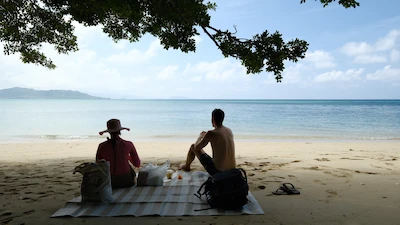 Having picnic lunch on a lone, secret beach
