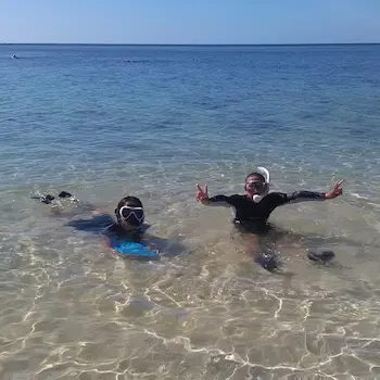 Children snorkeling in the shallow water